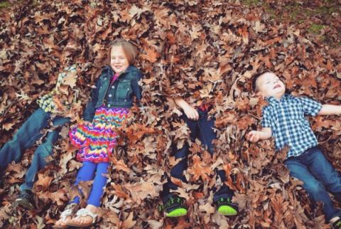 Kids in leaves in Fall