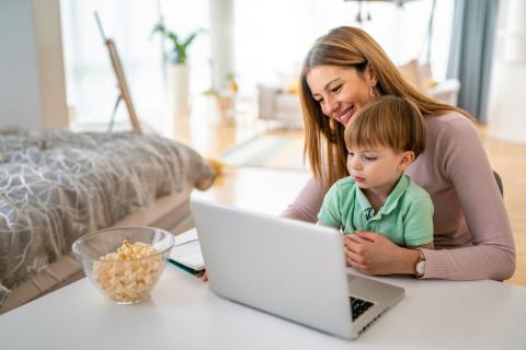Mom at computer with child