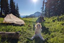 Image father and 3 year old daughter camping