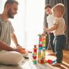 dad playing blocks with his little boys